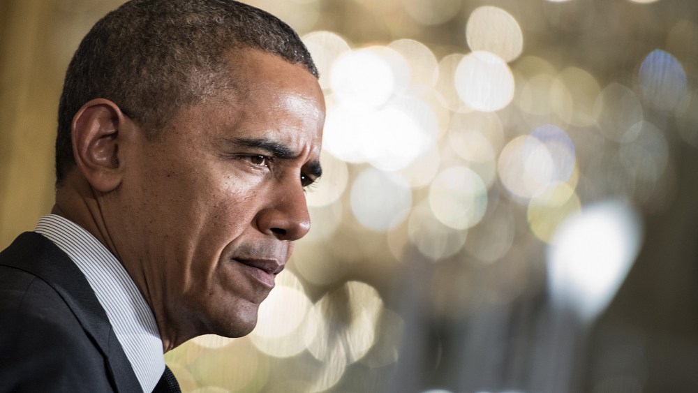 US President Barack Obama pauses while speaking during an event at the White House on April 30, 2014.