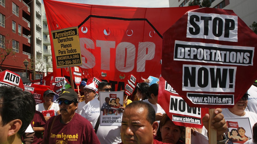 Marchers rally under the Chinatown Gateway during one a several May Day immigration-themed events on May 1, 2014 in Los Angeles, California.