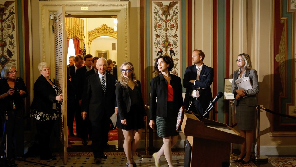 Nadya Tolokonnikova (R) and Maria Alyokhina (C), members of the Russian punk protest group Pussy Riot, leave the Senate Foreign Relations Committee room at the U.S. Capitol on May 6, 2014