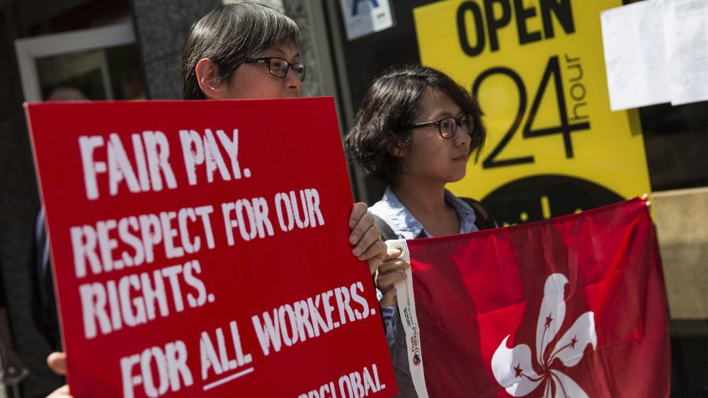 Protesters lobby for higher wages for fast food workers and urge fast food workers from around the globe to join their campaign outside a McDonalds on May 7, 2014 in New York City.