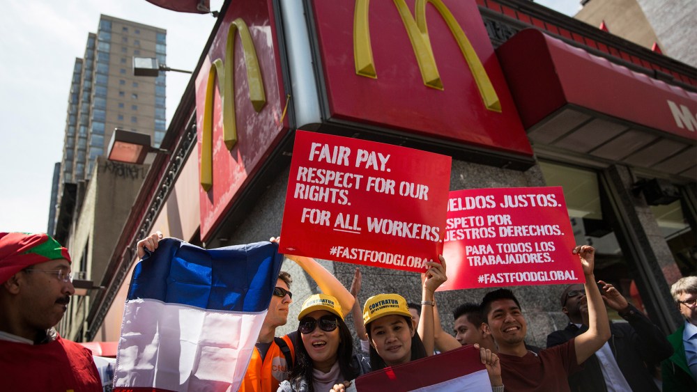 Protesters lobby for higher wages for fast food workers and urge fast food workers from around the globe to join their campaign outside a McDonalds on May 7, 2014 in New York City.