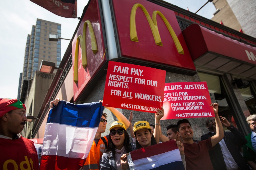 Protesters lobby for higher wages for fast food workers and urge fast food workers from around the globe to join their campaign outside a McDonalds on May 7, 2014 in New York City.