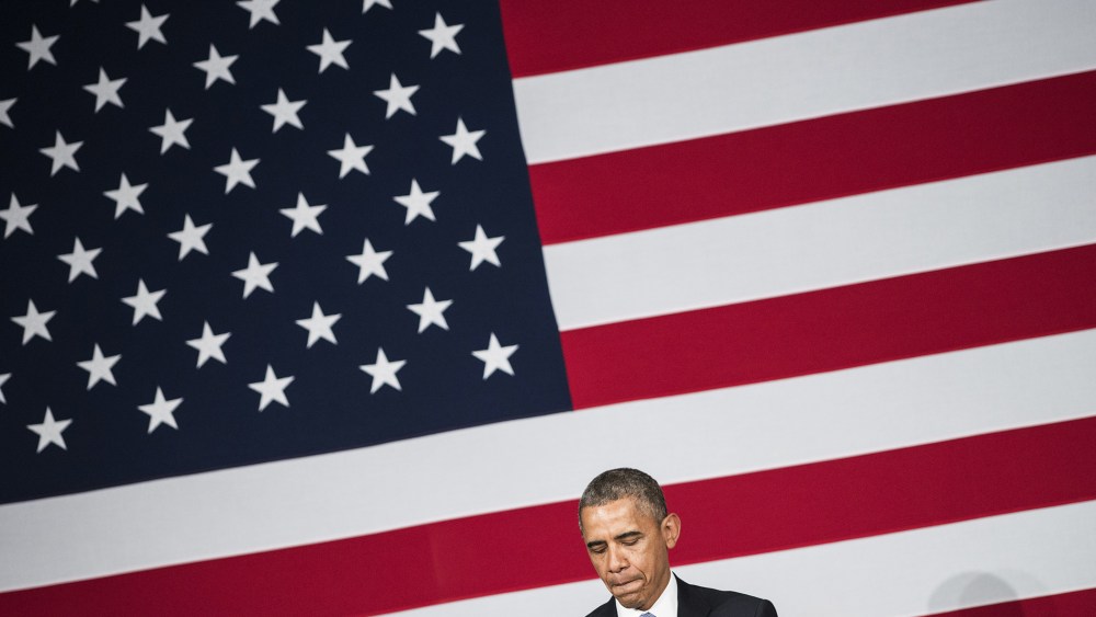 US President Barack Obama pauses while speaking during a reception for the Democratic National Committee May 8, 2014 in in San Jose, Calif.