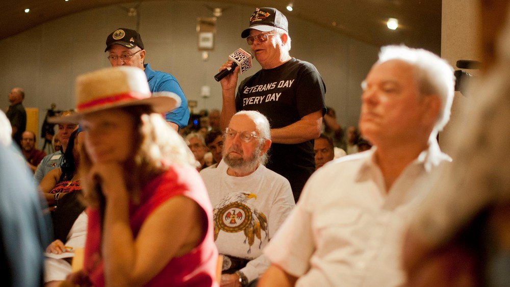 Veterans addresses Sen. John McCain at a forum in Phoenix, Arizona to discuss mismanagement of Veterans Affairs, May 9, 2014.
