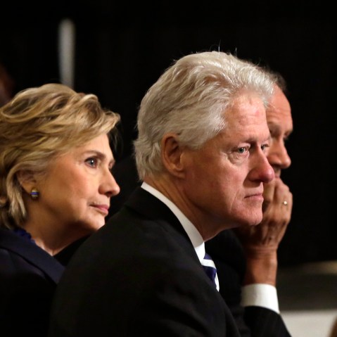 Bill and Hillary Clinton listen to ceremonies during the National September 11 Memorial Museum dedication ceremony on May 15, 2014 in New York City.