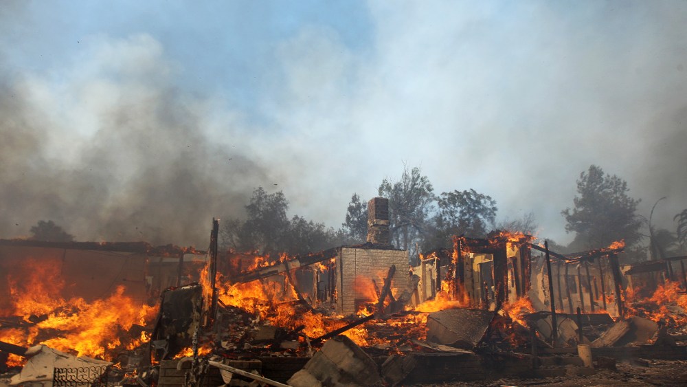A house burns at the Cocos fire on May 15, 2014 in San Marcos, California.