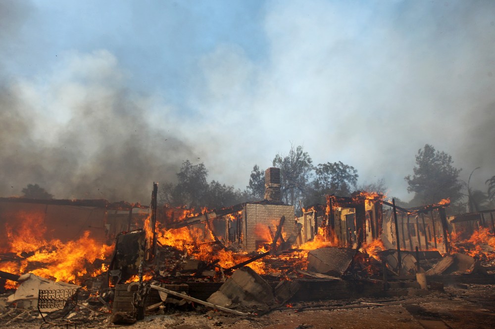 A house burns at the Cocos fire on May 15, 2014 in San Marcos, California.