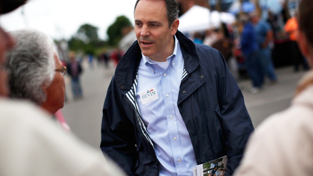 Then, Kentucky Republican senatorial candidate Matt Bevin talks with voters at the Fountain Run BBQ Festival while campaigning for the Republican primary May 17, 2014 in Fountain Run, Ky. (Photo by Win McNamee/Getty)