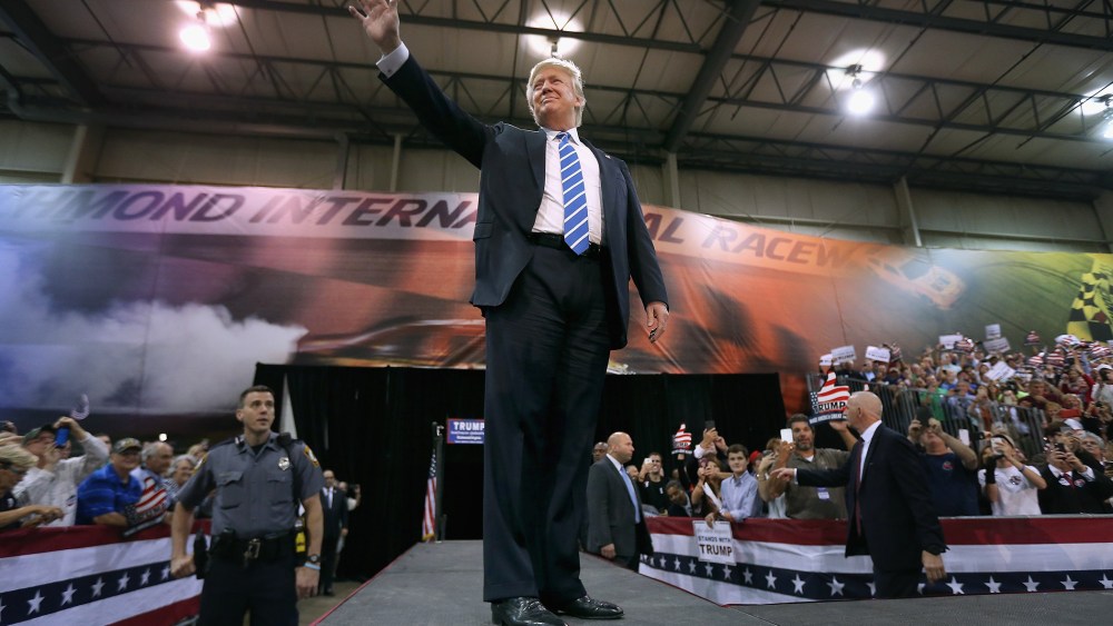Republican presidential candidate and front-runner Donald Trump walks out on stage during a campaign rally at the Richmond International Raceway on Oct. 14, 2015 in Richmond, Va. (Photo by Chip Somodevilla/Getty)