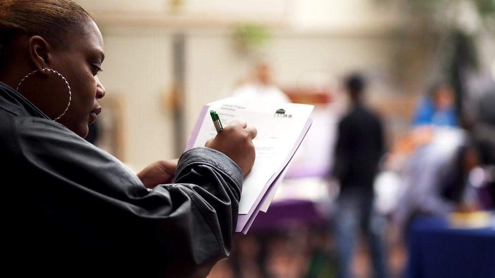 A job seeker fills out an application during a career fair on May 21, 2014 in San Francisco, California.