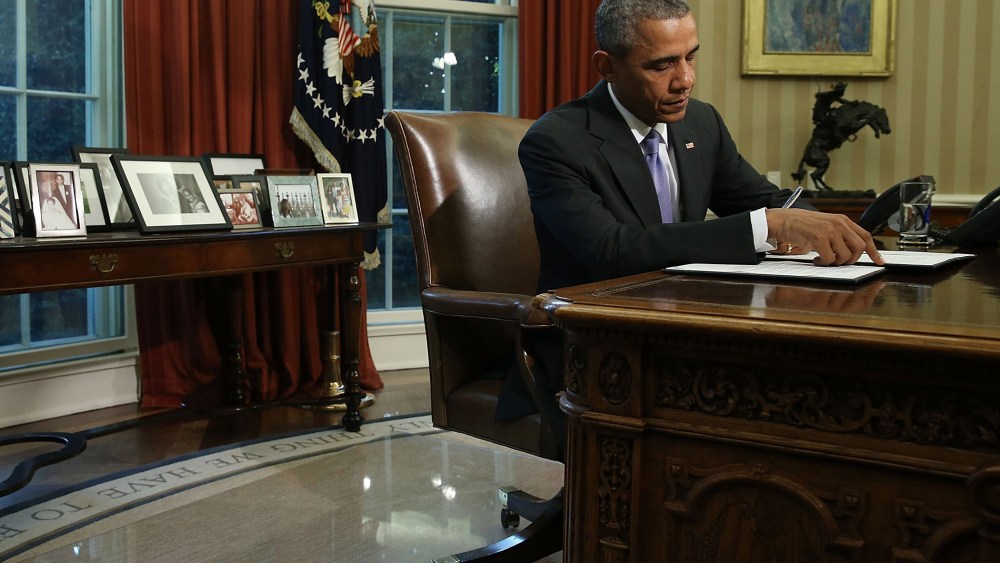 U.S. President Barack Obama signs a veto of H.R. 1735 National Defense Authorization Act (NDAA) in the Oval Office, Oct. 22, 2015 in Washington, DC. (Photo by Mark Wilson/Getty)