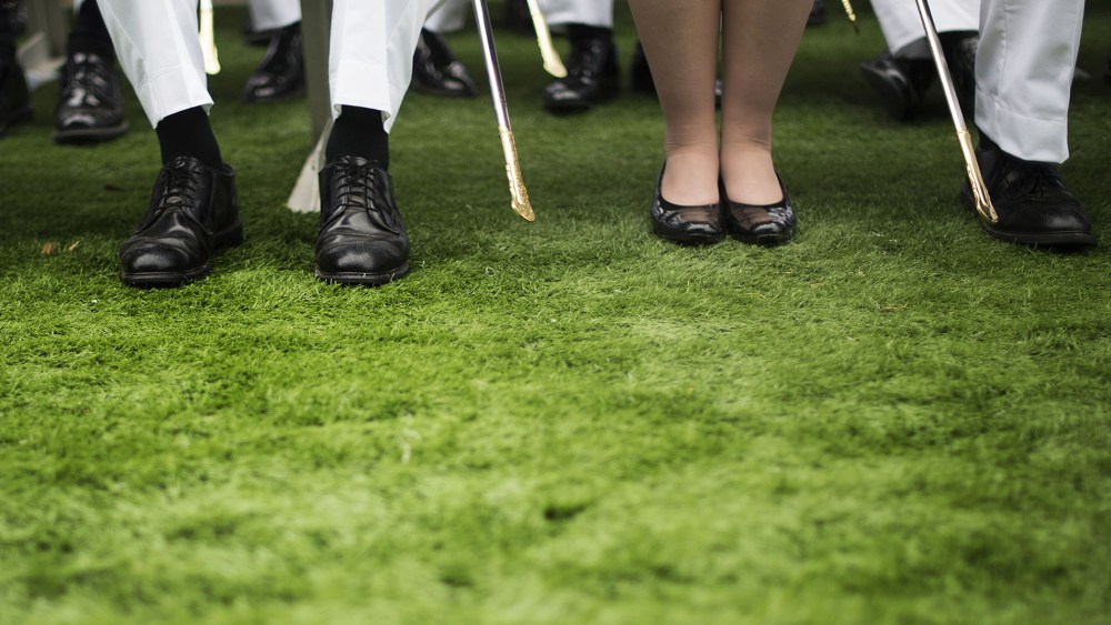 A female cadet sits among male cadets during a commencement ceremony in West Point, New York, May 28, 2014.