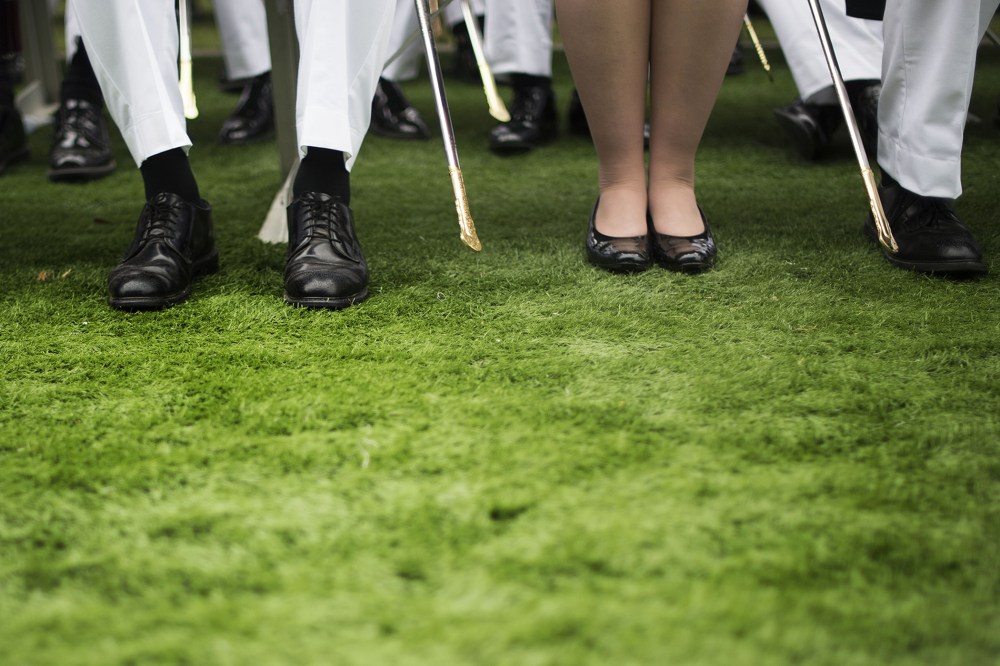 A female cadet sits among male cadets during a commencement ceremony in West Point, New York, May 28, 2014.