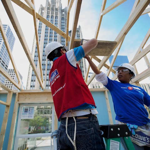 Volunteers erect a Habitat for Humanity home in Chicago, Ill., as part of an unprecedented building blitz in the heart of downtown Chicago. (Photo by Jeff Schear/Getty for Habitat For Humanity)