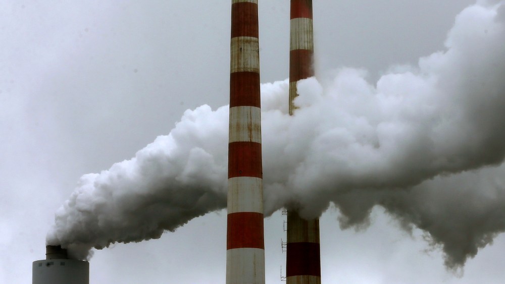 Emissions spew out of a large stack at the coal fired Morgantown Generating Station, on May 29, 2014 in Newburg, Md.