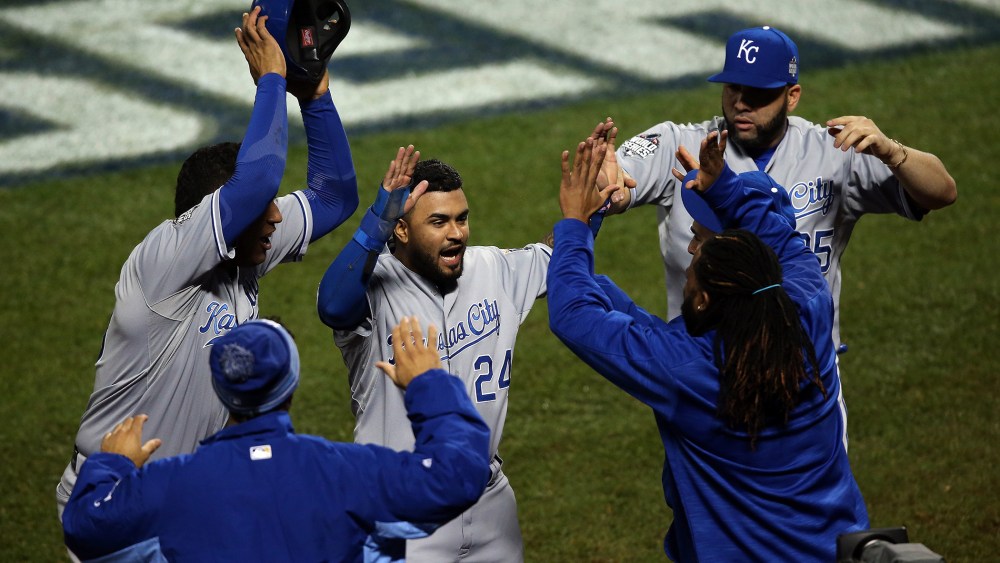 Christian Colon #24 of the Kansas City Royals celebrates after scoring in the 12th inning against the New York Mets during Game Five of the 2015 World Series at Citi Field on Nov. 1, 2015 in New York, N.Y. (Photo by Doug Pensinger/Getty)