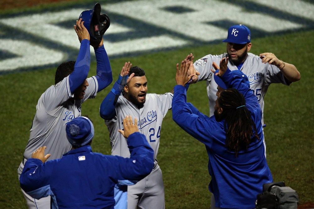 Christian Colon #24 of the Kansas City Royals celebrates after scoring in the 12th inning against the New York Mets during Game Five of the 2015 World Series at Citi Field on Nov. 1, 2015 in New York, N.Y. (Photo by Doug Pensinger/Getty)