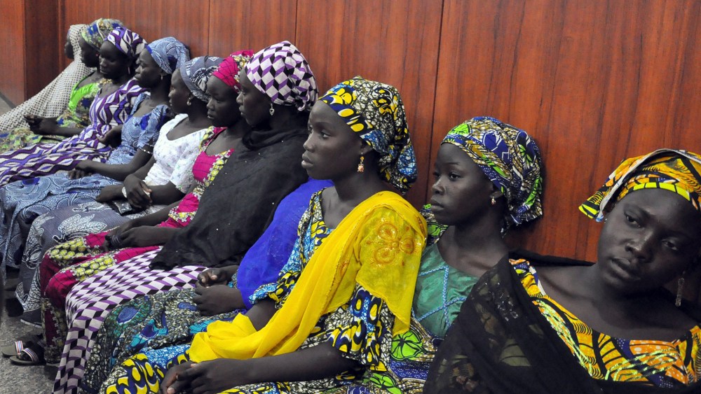 Schoolgirls who have escaped from Boko Haram kidnappers in the village of Chibok, sit at the Government house to speak with State Governor Kashim Shettima in Maiduguri on June 2, 2014.