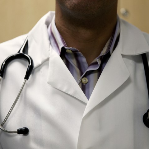 A doctor waits to see a patient. (Photo by Joe Raedle/Getty)