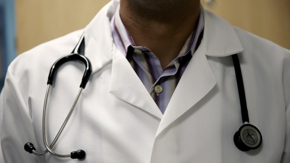 A doctor waits to see a patient. (Photo by Joe Raedle/Getty)