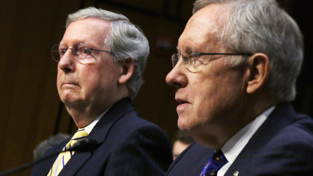 Senate Majority Leader Harry Reid (D-NV) (R) and Senate Minority Leader Mitch McConnell (R-KY) testify before the Senate Judiciary Committee about political donations and freedom of speech in the Hart Senate Office Building June 3, 2014 in Washington, DC.