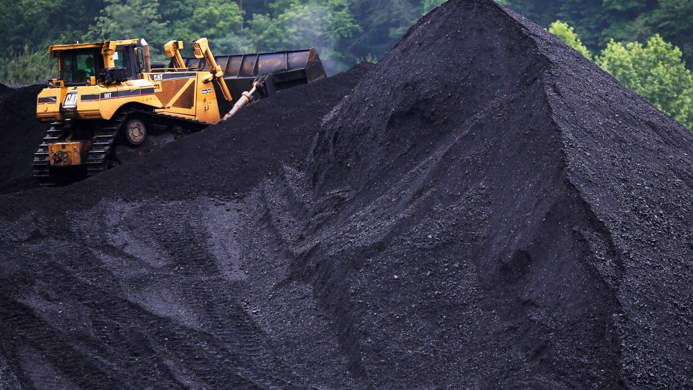 A bulldozer operates atop a coal mound at the CCI Energy Slones Branch Terminal June 3, 2014 in Shelbiana, Kentucky.