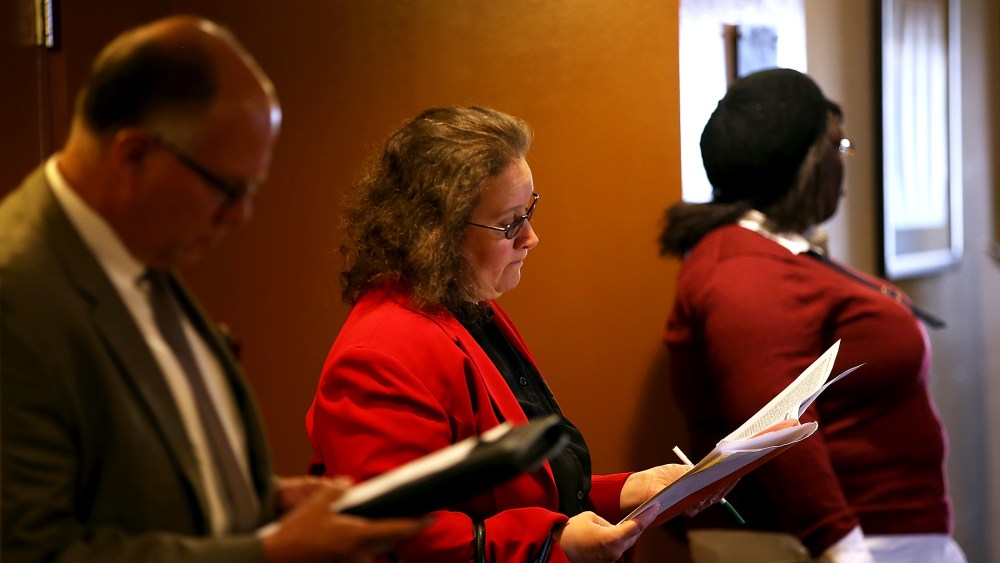 Job seekers fill out applications before the start of the HireLive career fair on June 4, 2014 in San Francisco, California.