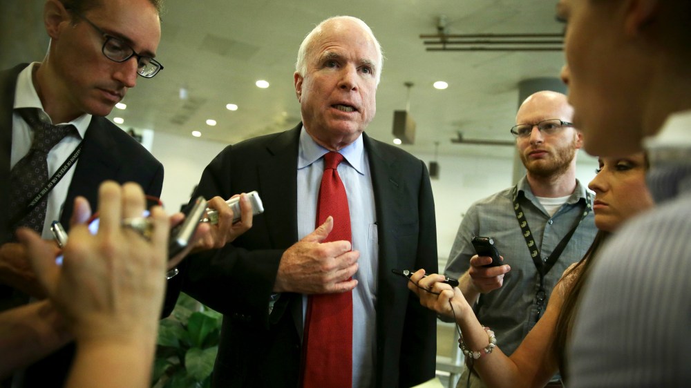 U.S. Sen. John McCain (R-AZ) talks to reporters after a closed door briefing June 4, 2014.