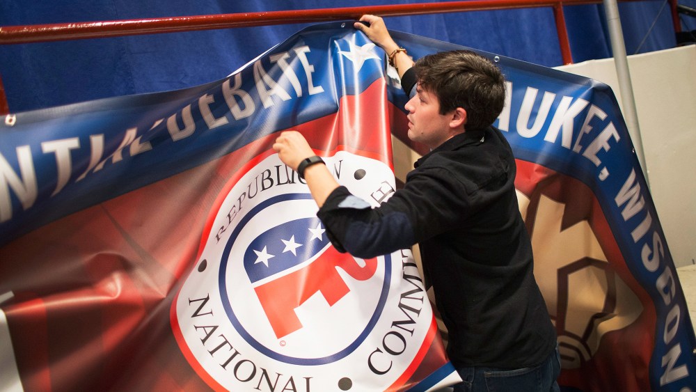 Kirt Gallatin helps to prepare for the Republican presidential debate sponsored by Fox Business News and the Wall Street Journal on Nov. 9, 2015 in Milwaukee, Wis. (Photo by Scott Olson/Getty)