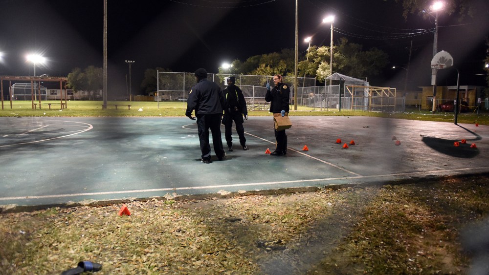 Police gather evidence after a shooting at a playground on Nov. 22, 2015 in New Orleans, La. (Photo by Cheryl Gerber/Getty)
