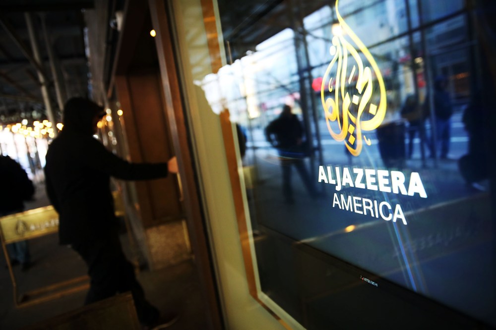 The logo for Al Jazeera America is displayed outside the cable news channel's offices on Jan. 13, 2016 in New York City. (Photo by Spencer Platt/Getty)