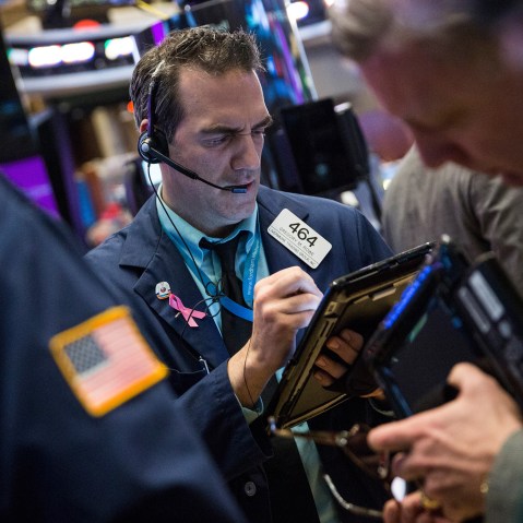 Traders work on the floor of the New York Stock Exchange during the morning of Jan. 19, 2016 in New York City. (Photo by Andrew Burton/Getty)