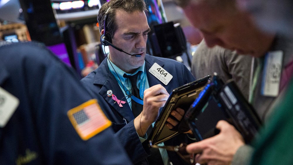 Traders work on the floor of the New York Stock Exchange during the morning of Jan. 19, 2016 in New York City. (Photo by Andrew Burton/Getty)