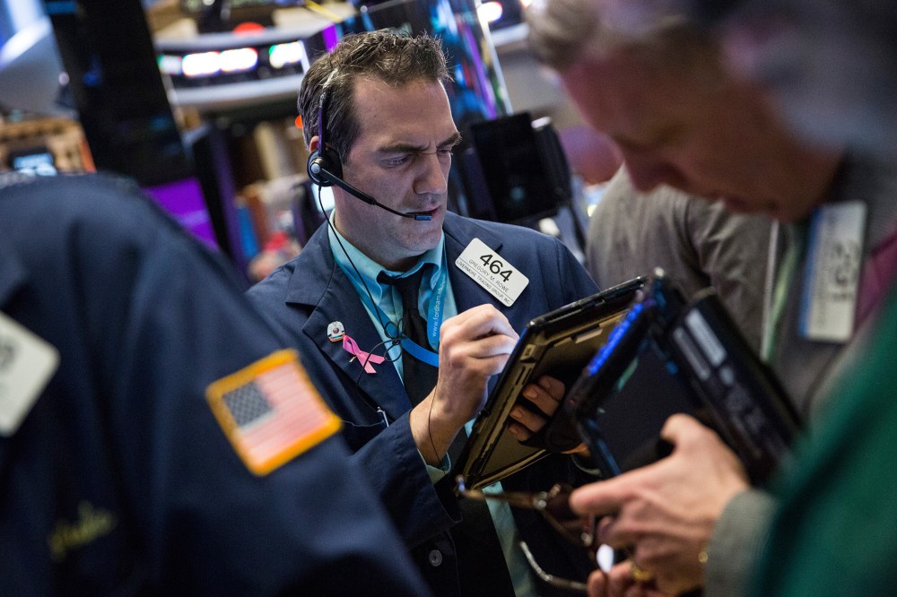 Traders work on the floor of the New York Stock Exchange during the morning of Jan. 19, 2016 in New York City. (Photo by Andrew Burton/Getty)