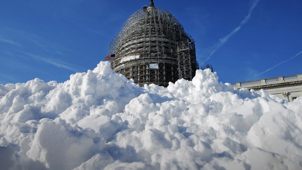 A pile of shoveled snow stands in the plaza on the east side of the U.S. Capitol Jan. 21, 2016 in Washington, DC. (Photo by Chip Somodevilla/Getty)