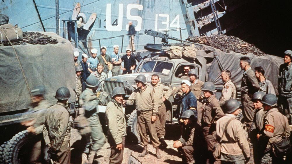 US soldiers gather around trucks disembarking from landing crafts shortly after Allied forces stormed the Normandy beaches, June 6, 1944.