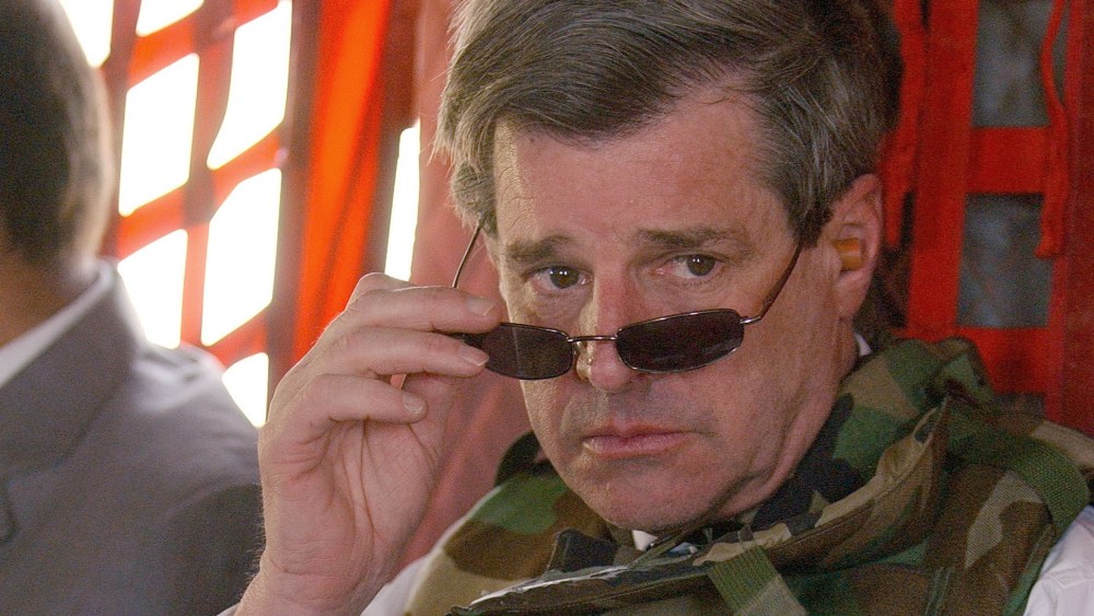 File Photo: Former U.S. civilian administrator in Iraq L. Paul Bremer (R) leaves the heavily-fortified Green Zone June 28, 2004 in Baghdad after signing the Iraqi Sovereignty document which gave full governmental authority to the Iraqi interim...