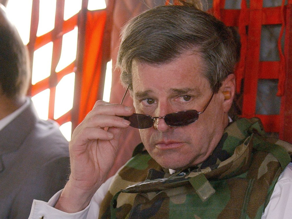 File Photo: Former U.S. civilian administrator in Iraq L. Paul Bremer (R) leaves the heavily-fortified Green Zone June 28, 2004 in Baghdad after signing the Iraqi Sovereignty document which gave full governmental authority to the Iraqi interim...