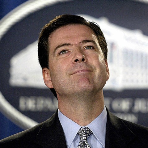 File Photo: US Deputy Attorney General James Comey takes questions on Aug. 5, 2004 at the Justice Department in Washington, DC. The Senate this week confirmed Comey’s nomination as head of the FBI. (Photo by Tin Sloan/AFP/Getty Images, File)