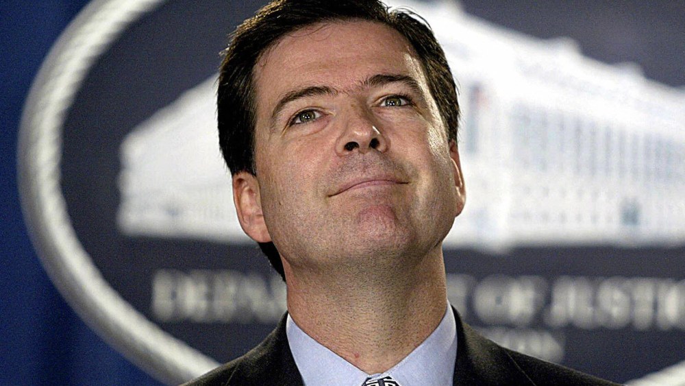 File Photo: US Deputy Attorney General James Comey takes questions on Aug. 5, 2004 at the Justice Department in Washington, DC. The Senate this week confirmed Comey’s nomination as head of the FBI. (Photo by Tin Sloan/AFP/Getty Images, File)