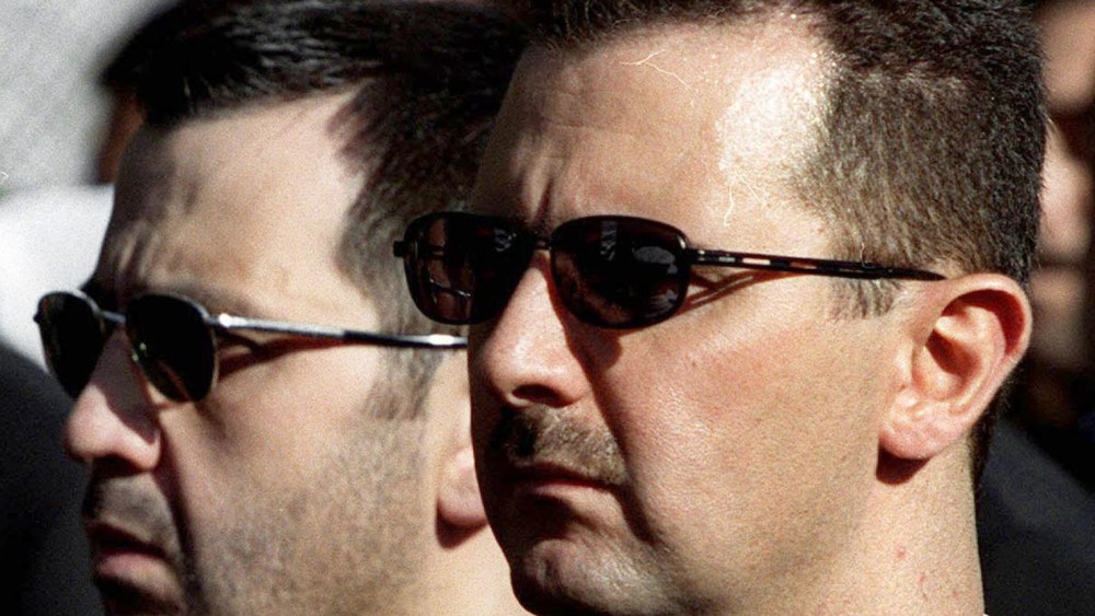 DAMASCUS, SYRIA:  The sons of Syria's late President Hafez al-Assad, Maher (L) and heir apparent, Bashar (R), march behind their father's coffin during his funeral in Damascus 13 June 2000. Assad, who ruled his country with an iron fist for 30 years,...