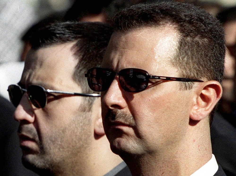 DAMASCUS, SYRIA: The sons of Syria's late President Hafez al-Assad, Maher (L) and heir apparent, Bashar (R), march behind their father's coffin during his funeral in Damascus 13 June 2000. Assad, who ruled his country with an iron fist for 30 years,...
