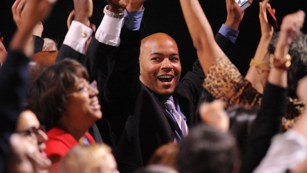 US President Barack Obama supporters celebrate as CNN projected The President re-elected on election night November 6, 2012 in Chicago, Illinois.  (Photo by ROBYN BECK/AFP/Getty Images)