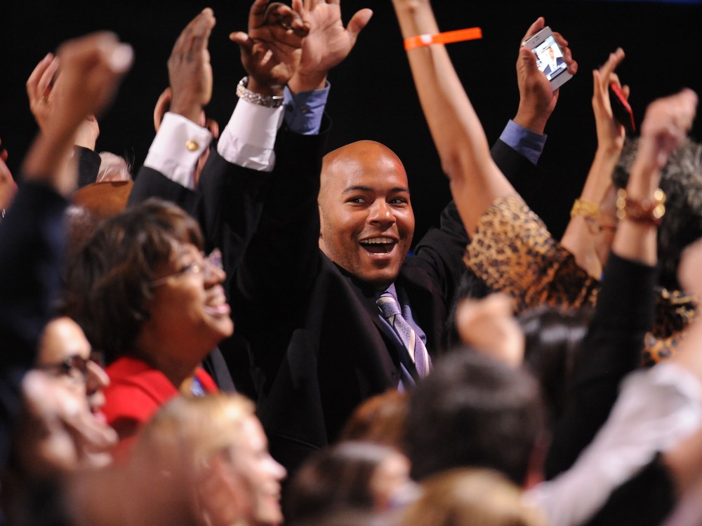 US President Barack Obama supporters celebrate as CNN projected The President re-elected on election night November 6, 2012 in Chicago, Illinois. (Photo by ROBYN BECK/AFP/Getty Images)