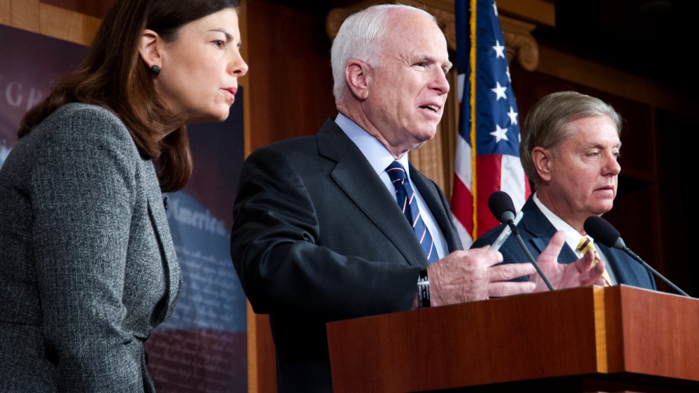 US Senators John McCain(C) (R-AZ), Lindsey Graham(R) (R-SC) and Kelly Ayotte (R-NH) hold a press conference (Photo by Karen Bleier/AFP/Getty Images)