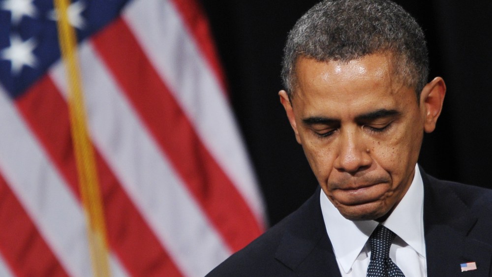 US President Barack Obama pauses as he speaks during a memorial service for the victims and relatives of the Sandy Hook Elementary School shooting on December 16, 2012 in Newtown, Connecticut. (Photo by Mandel Ngan/AFP/Getty Images)