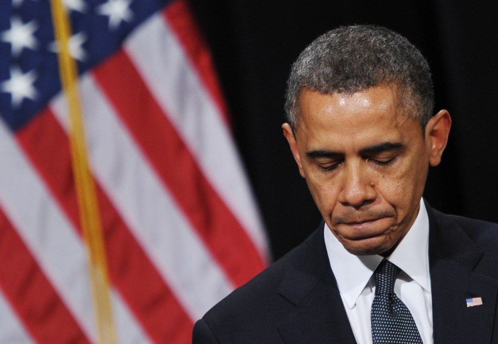 US President Barack Obama pauses as he speaks during a memorial service for the victims and relatives of the Sandy Hook Elementary School shooting on December 16, 2012 in Newtown, Connecticut. (Photo by Mandel Ngan/AFP/Getty Images)