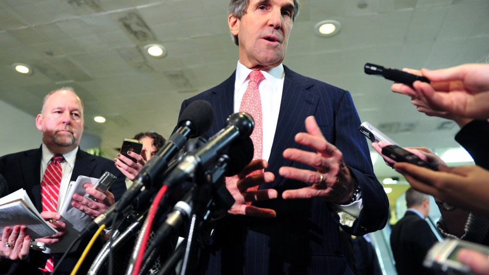 US Senate Foreign Relations Committee Chairman Sen. John Kerry (C), D-MA, speaks to reporters on December 19, 2012 on Capitol Hill in Washington, DC  following a full committee closed door briefing on the Benghazi. (Photo by Karen Bleier/AFP/Getty Images)