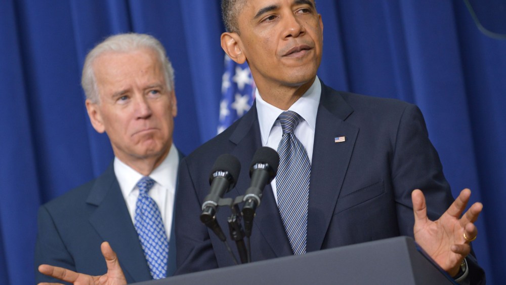 US President Barack Obama speaks on proposals to reduce gun violence as Vice President Joe Biden watches on January 16, 2013 in the South Court Auditorium of the Eisenhower Executive Office Building, next to the White House in Washington, DC. President...