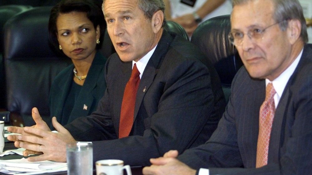 File Photo: US President George W. Bush (C) answers questions from the media as US National Security Adviser Condoleezza Rice (L) and US Secretary of Defense Donald Rumsfeld (R) look on during a meeting with military leaders at the Pentagon 17...